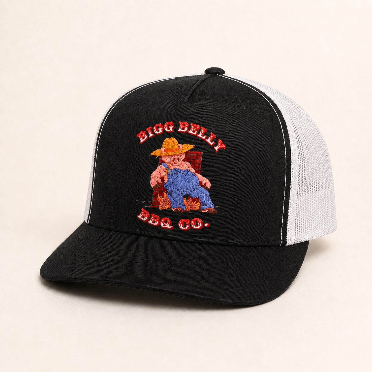 Bigg Belly BBQ Co. black trucker hat with white mesh back and the pig mascot embroidered on the front